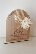 Dried floral wooden plaque with acrylic and/or laser engraved text or name, either arch or round shape, with dried preserved flowers tied to the plaque. Perfect for baby birth announcements or personalised gifts or keepsakes. Midwife gift - nurse gift - doctor gift