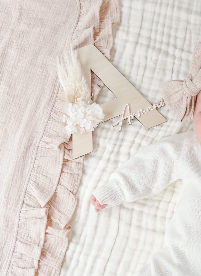 Dried floral wooden plaque with acrylic and/or laser engraved text or name, letter/initial, with dried preserved flowers tied to the plaque. Perfect for baby birth announcements or personalised gifts or keepsakes.