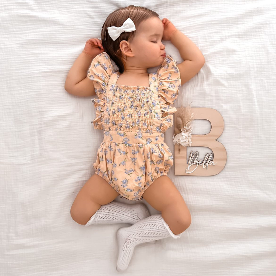 Dried floral wooden plaque with acrylic and/or laser engraved text or name, letter/initial, with dried preserved flowers tied to the plaque. Perfect for baby birth announcements or personalised gifts or keepsakes.