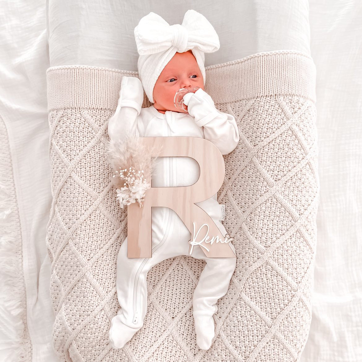 Dried floral wooden plaque with acrylic and/or laser engraved text or name, letter/initial, with dried preserved flowers tied to the plaque. Perfect for baby birth announcements or personalised gifts or keepsakes.